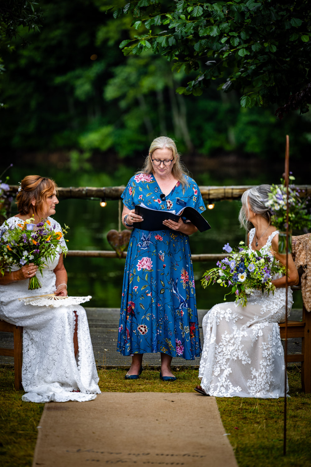 Deb Reed Celebrant Colchester Essex, officiating at the wedding of Cheyney and Albert during their first kiss.